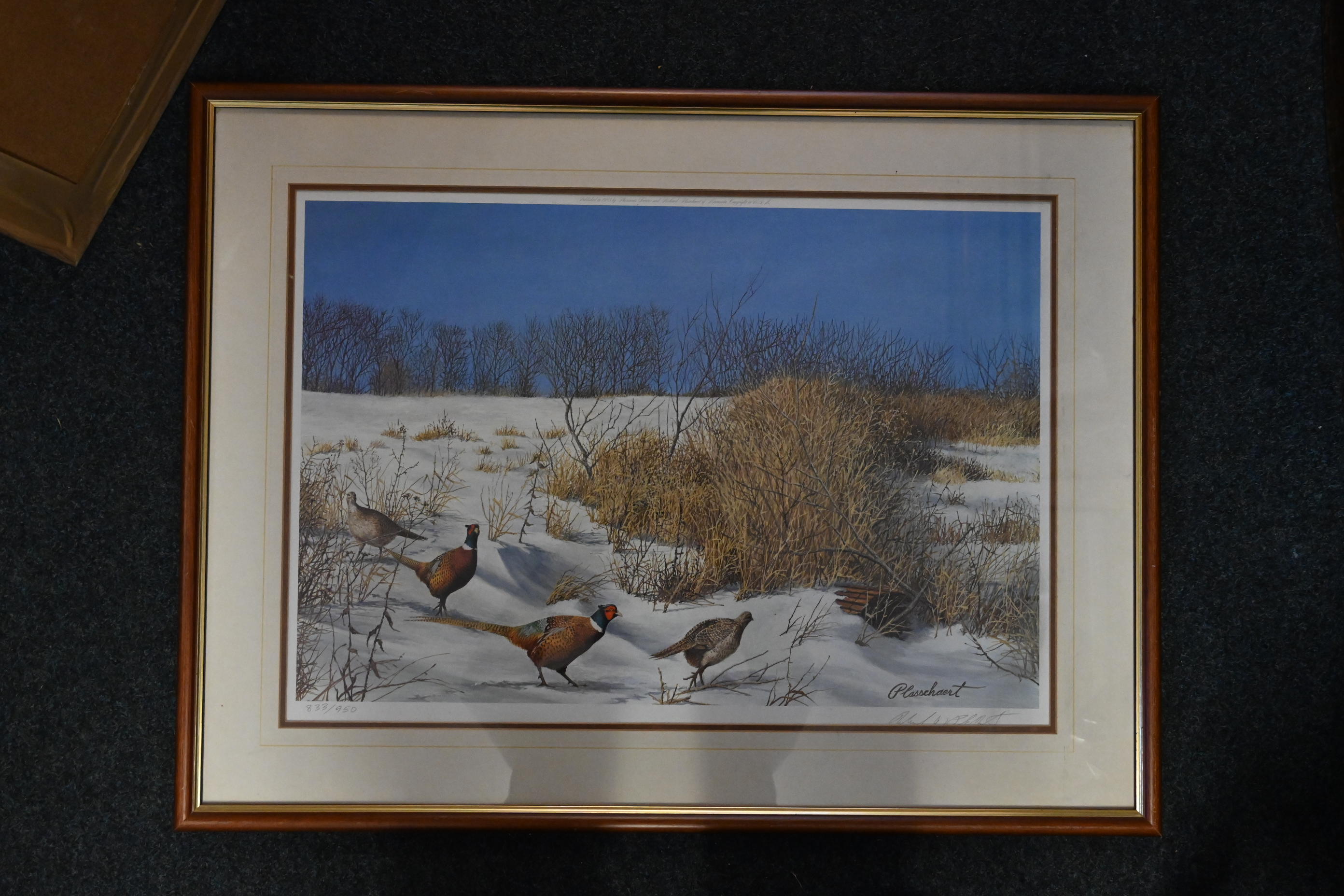 After Richard Plasschaert, Minnesota USA (b. 1941) signed print of Pheasants in snow landscape - Image 2 of 3