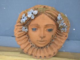 Terracotta Ladies face decorative wall plaque. Diameter 24cm approx