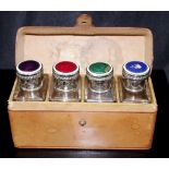 Boxed set 4 leather cased glass perfume bottles
