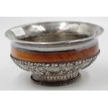Tibetan embossed silver and timber alms bowl