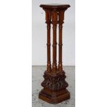 Ornately carved pedestal stand