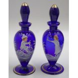 Two Mary Gregory blue glass perfume bottles