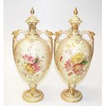 Pair of Royal Worcester blush ivory lidded urns