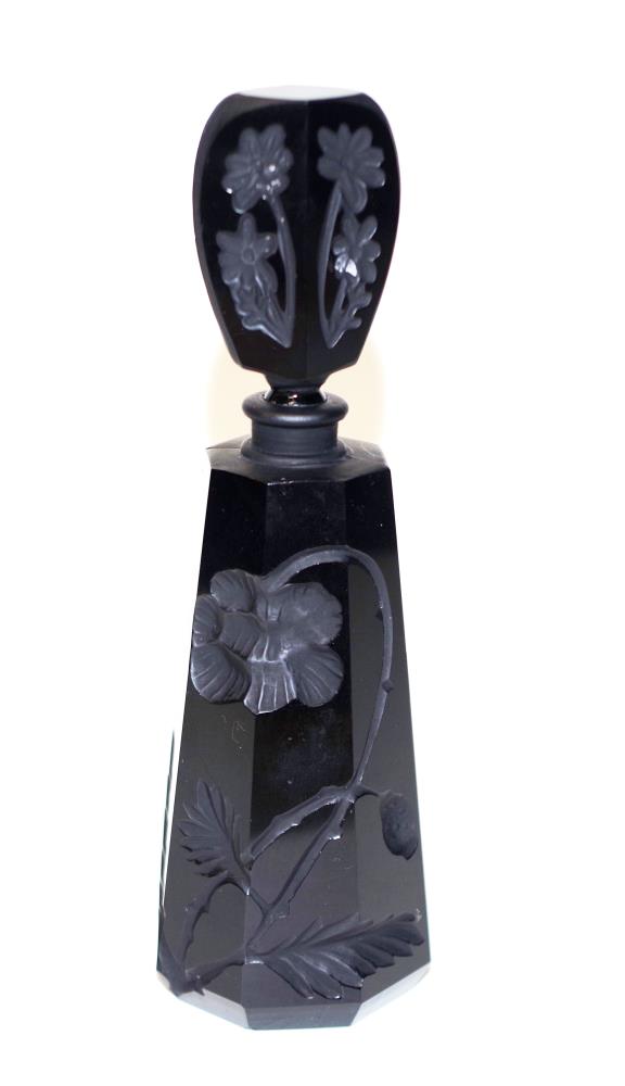 Black glass perfume bottle with floral design