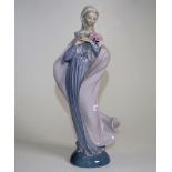 Lladro young lady figure holding flowers