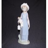 Lladro girl with doll figure