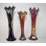 Three early amethyst carnival glass vases