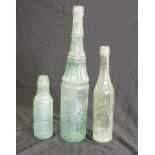 Three early glass bottles