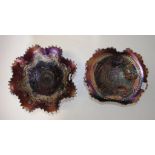 Two early amethyst carnival glass footed bowls