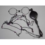 Pair of lorgnettes glasses and chain