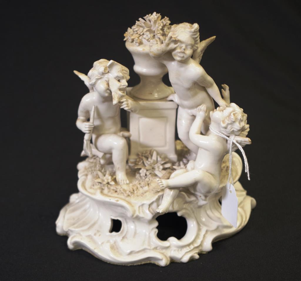 Continental white porcelain cupid glazed group