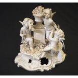 Continental white porcelain cupid glazed group