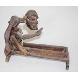 Tribal carved wood seated man figure