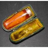 Cased hallmarked silver and amber cigarette holder