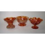 Three carnival glass footed bowls