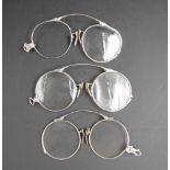 Three pairs of antique pinch nose spectacles