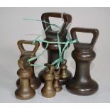 Early seven piece graduated set brass bell weights