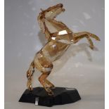 Swarovski power of motion golden stallion