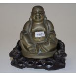 Chinese brass Buddha on a carved timber stand