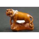 Japanese boxwood netsuke carving of a tiger