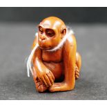 Japanese boxwood netsuke carving of a monkey