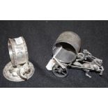 Two early silver plate figural napkin rings