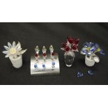 Four various Swarovski crystal flower ornaments