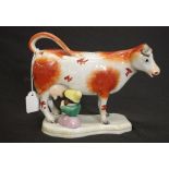 Antique painted ceramic cow figure creamer