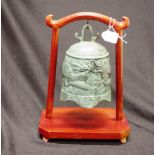 Chinese bronze ritual bell on wood stand
