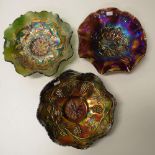 Three amethyst carnival glass bowls