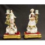 Two Victorian Derby painted figural candlesticks