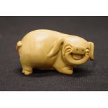 Japanese boxwood netsuke of a laughing pig