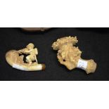 Two carved meerschaum pipe ends