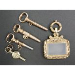 Four antique gold cased pocket watch keys