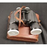 Pair of leather cased vintage binoculars