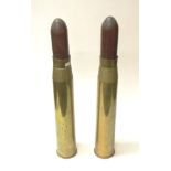 Pair early brass artillery shell casings