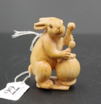 Japanese carved wood drummer rabbit netsuke