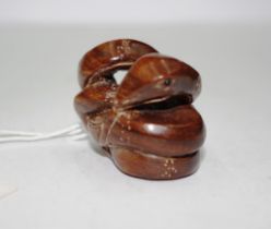 Japanese carved wood snake netsuke