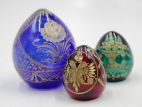 Three modern Faberge glass eggs
