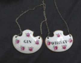 Two painted ceramic decanter labels