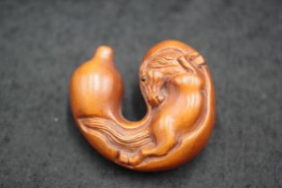 Japanese carved timber netsuke of a horse