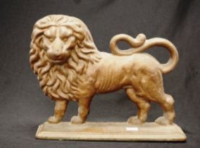 Early cast iron lion door stopper