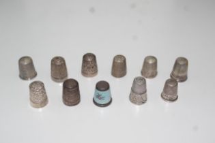 Quantity of eleven thimbles including silver