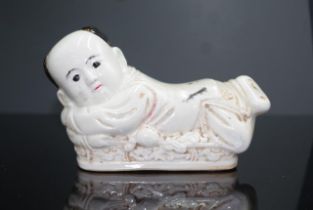 Chinese ceramic resting monk figure