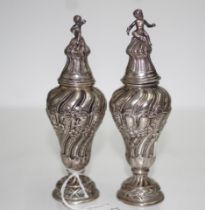 Pair of ornate German silver pepperettes