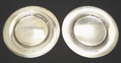 Two Georg Jensen hammered silver charger/plate