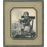 Daguerreotypes: Portrait of a girl and her doll