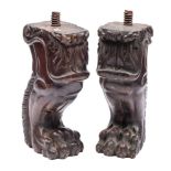 A pair of carved walnut monopodia in Baroque style,