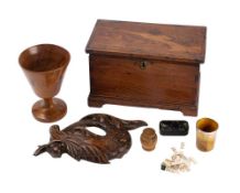 A 19th century olive wood goblet, 16cm high, a treen carving, a horn beaker, a treen box,