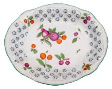 A Chelsea shaped oval dish moulded with panels of basket weave and flower heads,